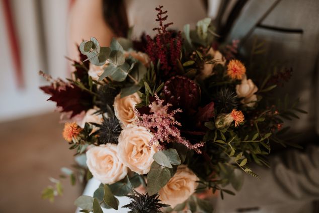 Red, white and green winter wedding flowers