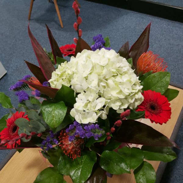 White, purple and red flower arrangement
