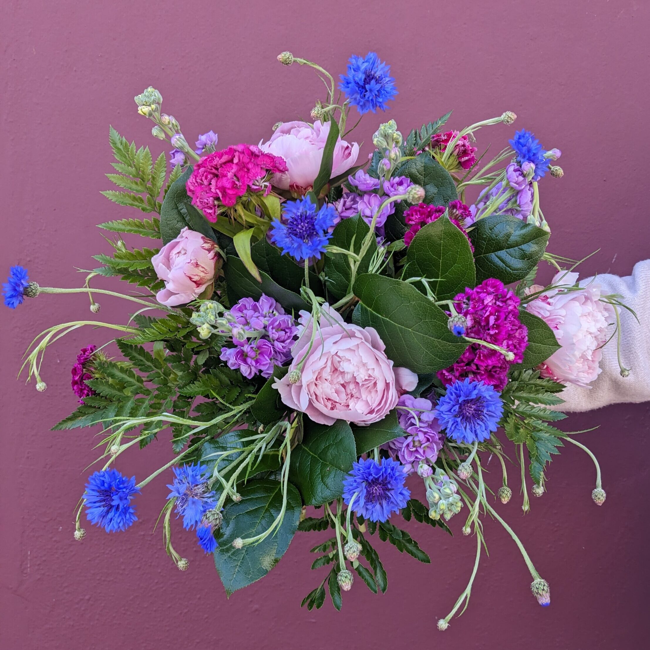 natural bouquet with pink, blue and purple flowers