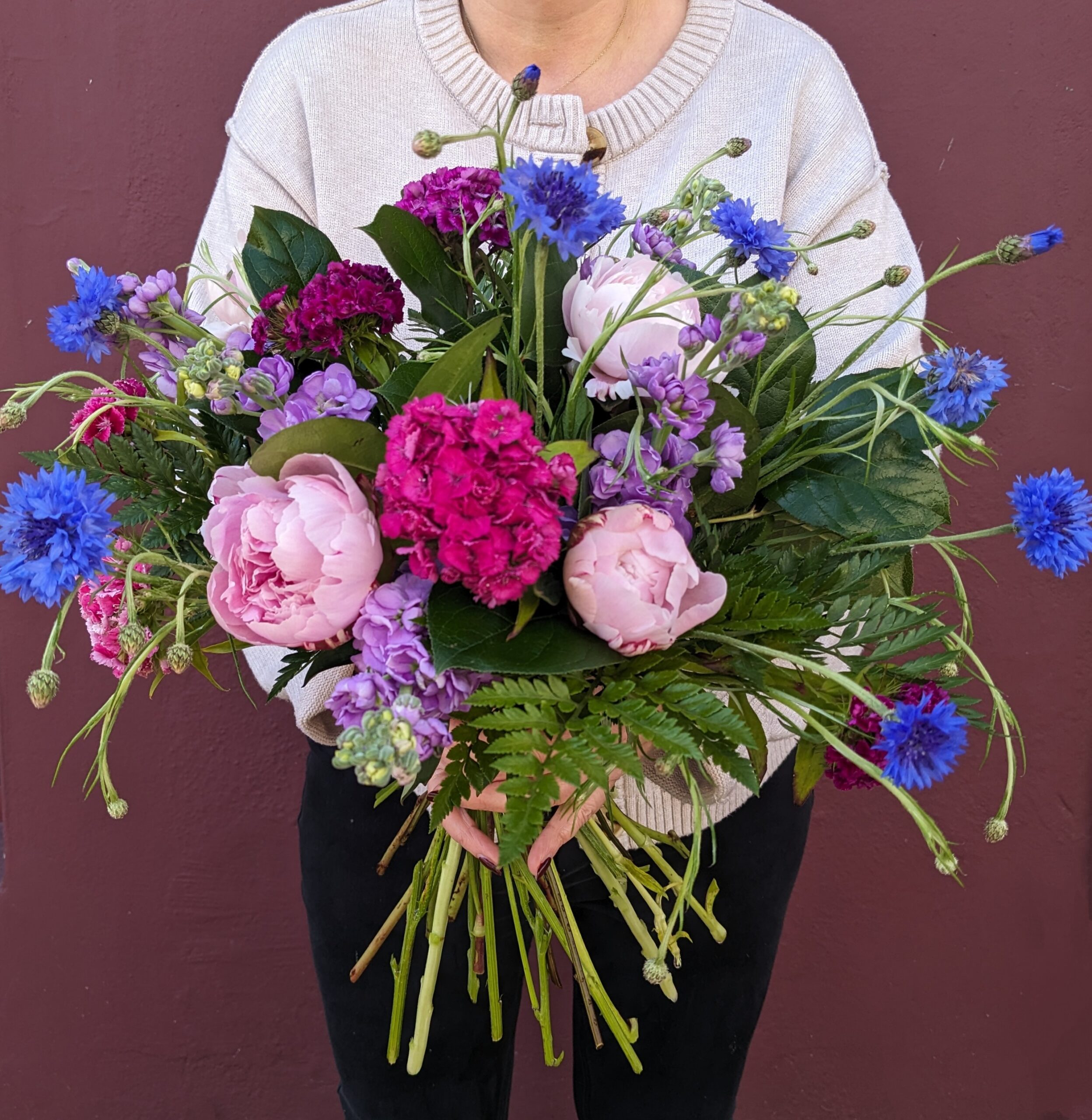 natural looking bouquet in pinks, blues and purples