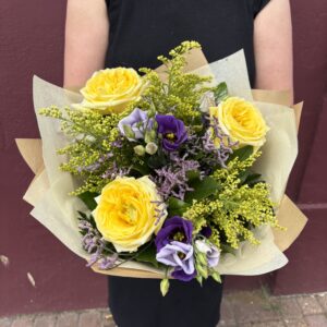 bouquet with yellow roses and purple mix